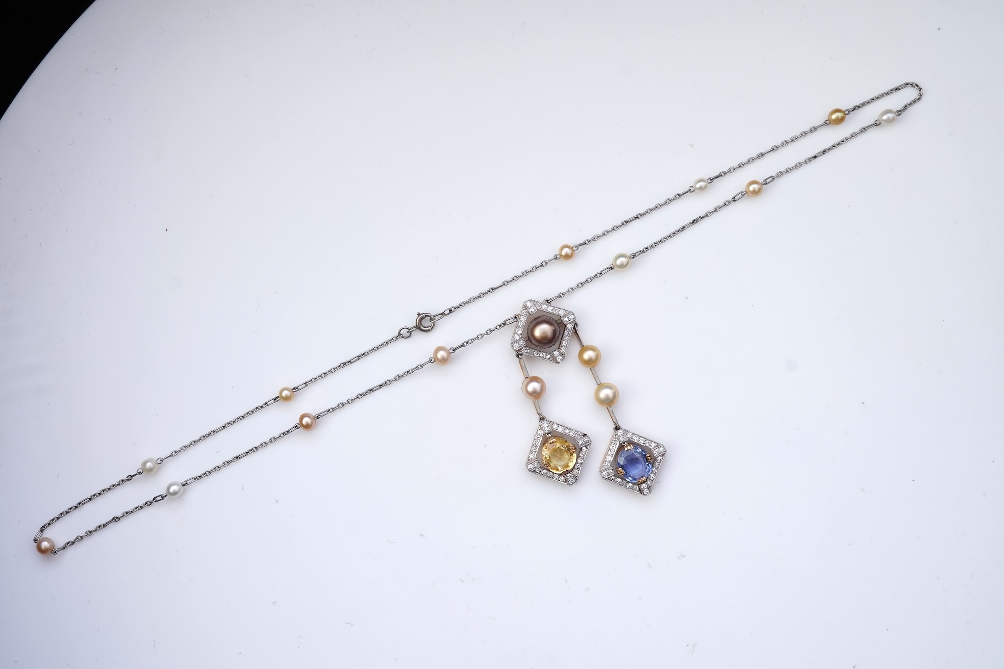 An Art Deco sapphire, natural pearl and diamond necklace, circa 1920